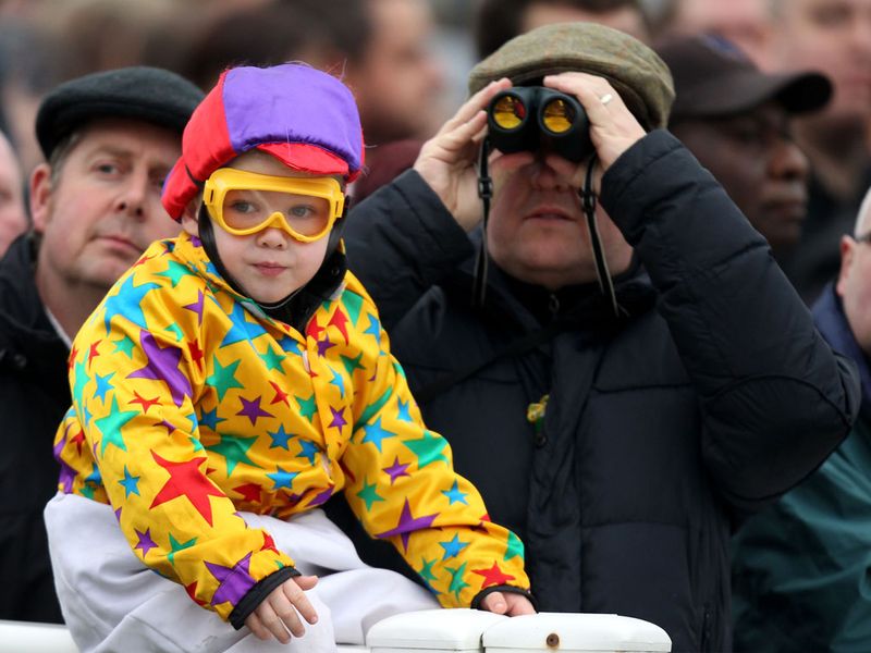 A young racegoer wins the best dressed prize