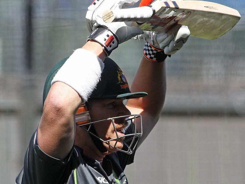 David Warner warned up as he contemplated his poor form.