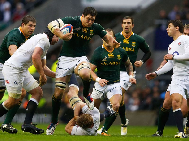 Francois Louw takes on England's defence