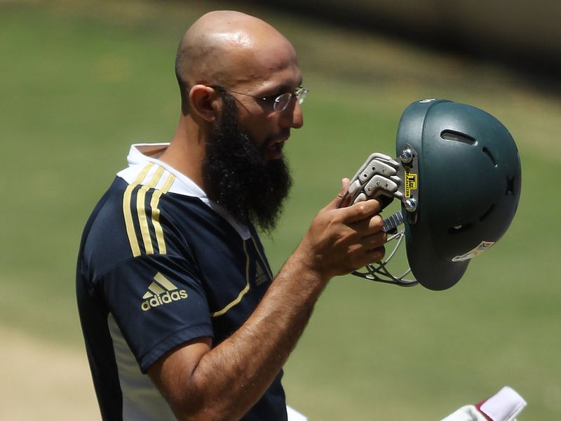 For the Proteas, Hashim Amla inspected his helmet before batting in the nets.