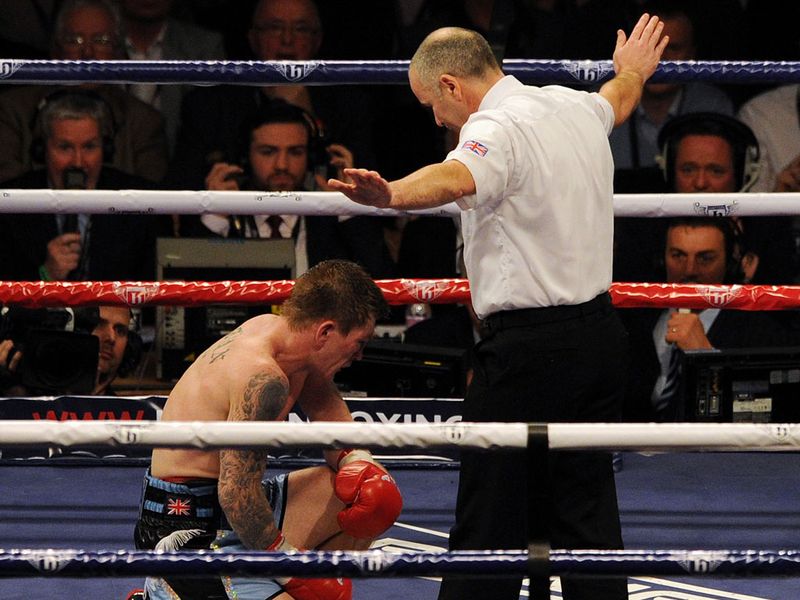 Referee John Keane calls an end to the fight after Hatton fails to regain his feet after 10 seconds