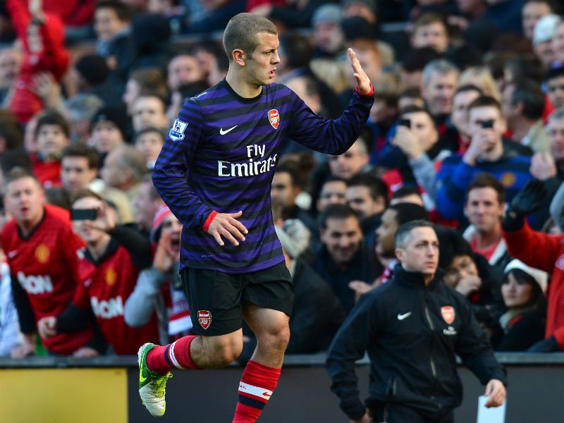 Seeing red: Jack Wilshere is sent off against Man Utd before Santi Cazorla nets a late consolation for the Gunners