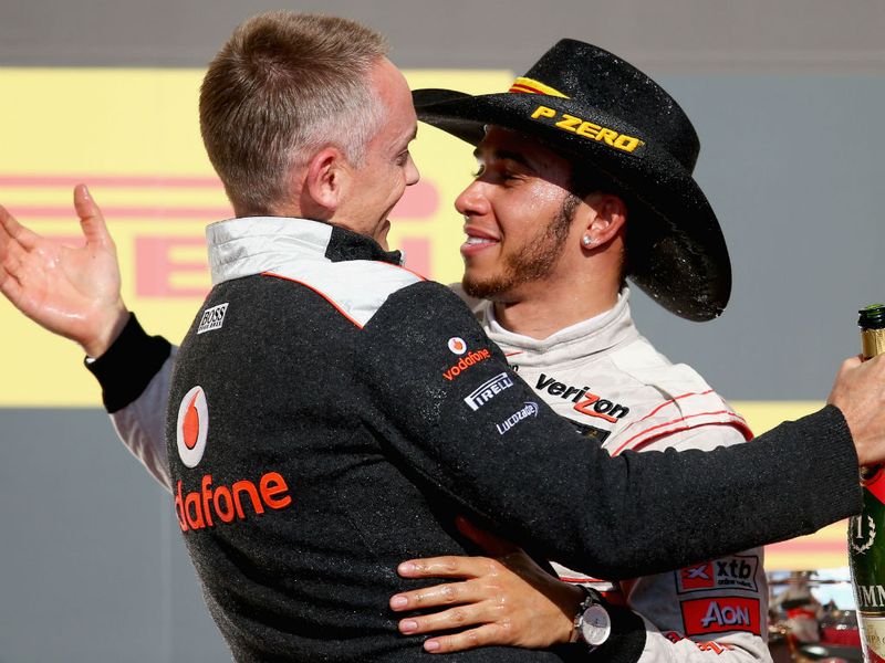 Martin Whitmarsh and Lewis Hamilton embrace