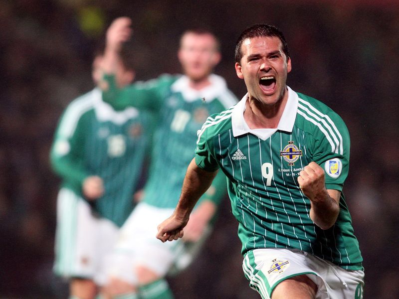 Deep into stoppage time, David Healy scores to rescue a 1-1 draw