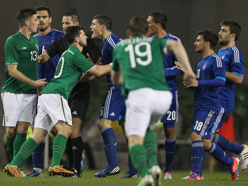 Irish and Greek players clash just before the interval