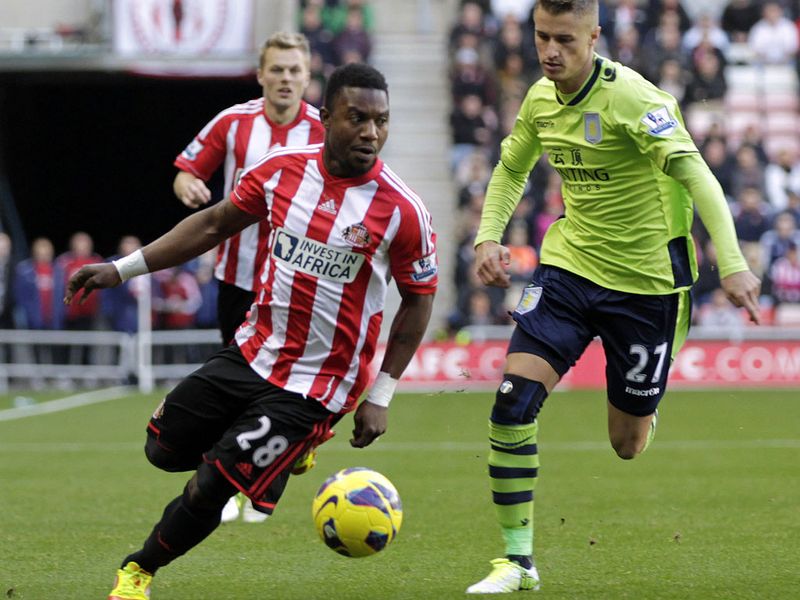 ...with Sessegnon also battling Joe Bennett for the ball