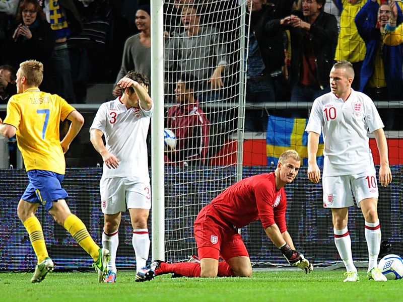 England goalkeeper Joe Hart and his team-mates look dejected as the hosts take the lead