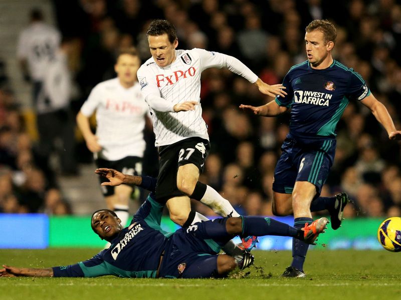 Danny Rose slides in with a challenge on Sascha Riether as a closely-fought first half ends goalless.