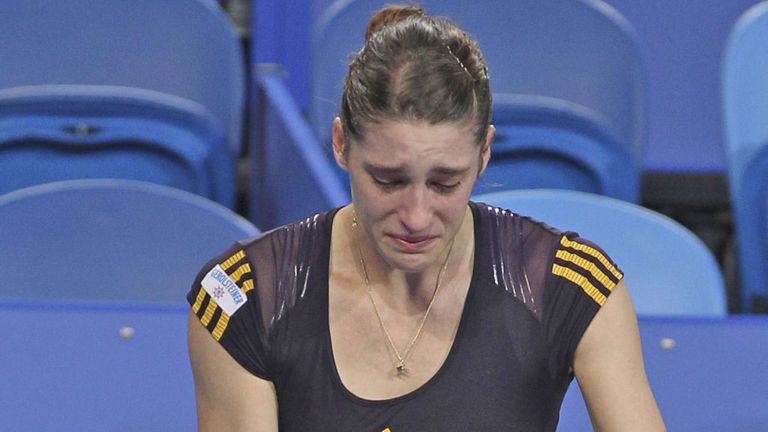 Andrea Petkovic (right) pulls out of her Hopman Cup match
