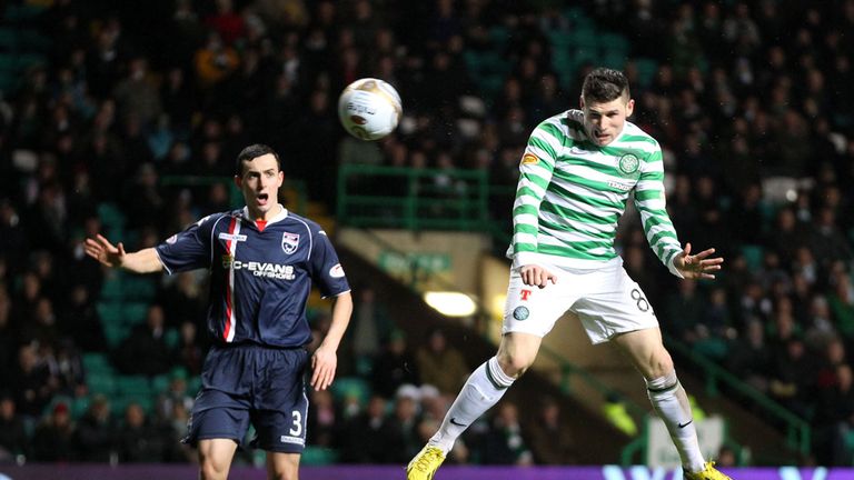 Hooper heads his second of the game at Celtic Park