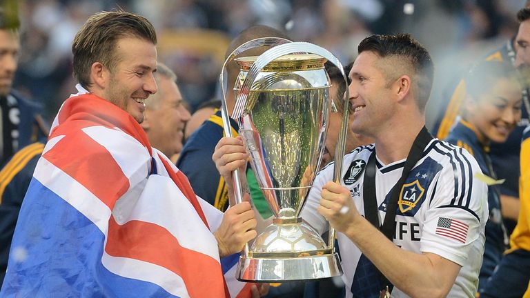 David Beckham and Robbie Keane lift the MLS Cup