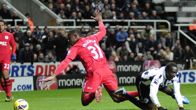 Papiss Cisse takes a tumble under the challenge of Maynor Figueroa