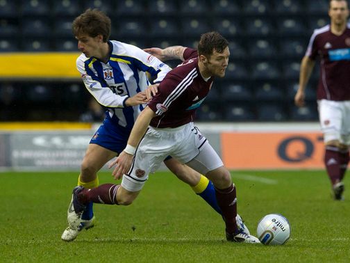 Borja Perez and Darren Barr battle for the ball