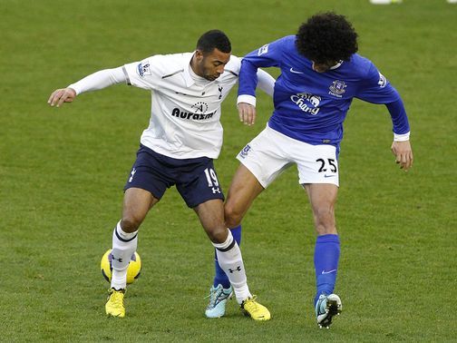 Mousa Dembele and Marouane Fellaini vie for the ball