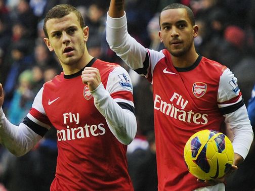 Wilshere (l) wants Walcott to join him in signing a new contract