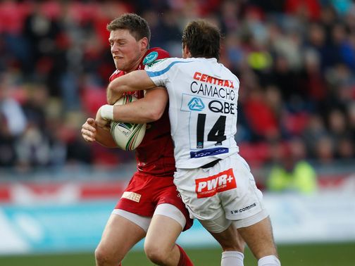 Rhys Priestland is tackled by Gonzalo Camacho