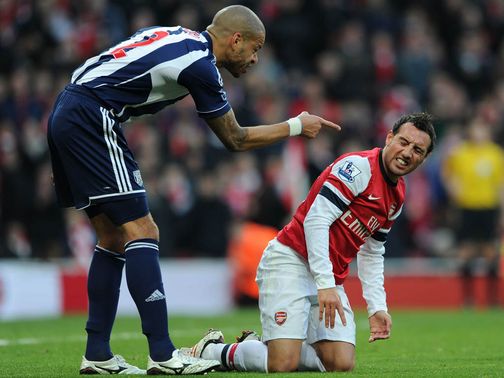 Steven Reid takes issue with Santi Cazorla