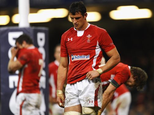 Inconsolable Welsh players after their late defeat