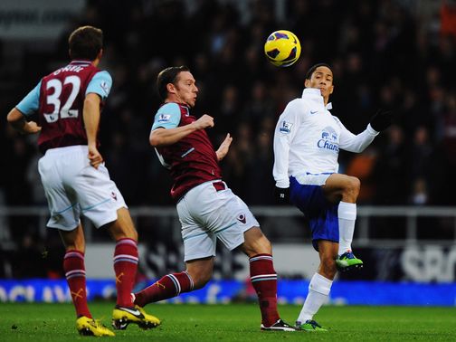 Kevin Nolan and Steven Pienaar challenge for the ball