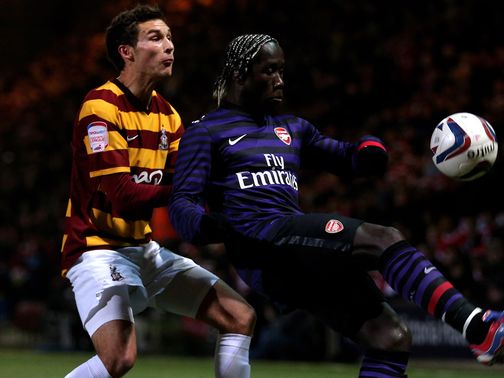Will Atkinson and Bacary Sagna battle for the ball