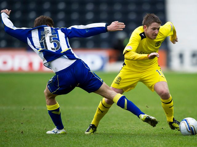 Borja Perez tries to stop Paul Cairney