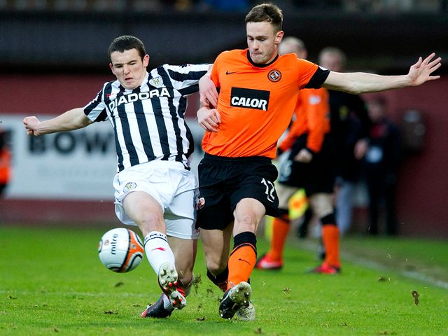 John McGinn challenges Keith Watson