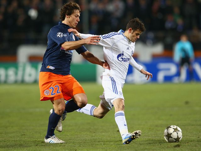 Stambouli and Barnetta battle for the ball