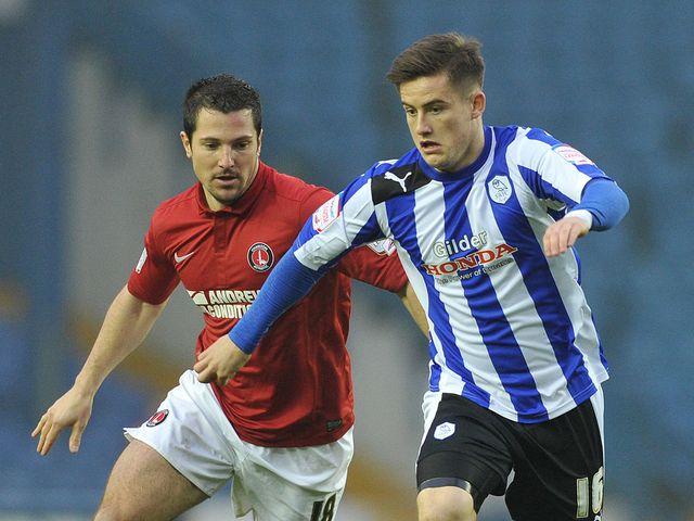 Yann Kermorgant and Rhys McCabe battle for the ball