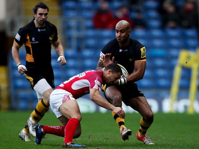 Wasps' Tom Varndell is tackled by Dan Caprice