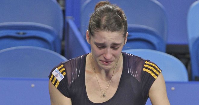 Andrea Petkovic (right) pulls out of her Hopman Cup match