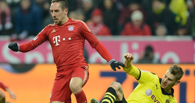 Franck Ribery is challenged by Lukas Piszczek