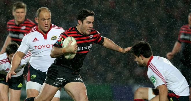 Brad Barritt of Saracens steps inside Conor Murray of Munster