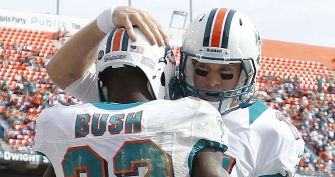 Reggie Bush: congratulated by Ryan Tannehill after one of his three touchdowns