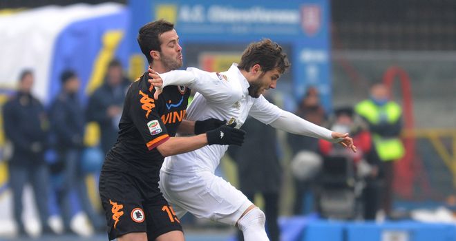 Miralem Pjanic battles with Perparim Hetemai