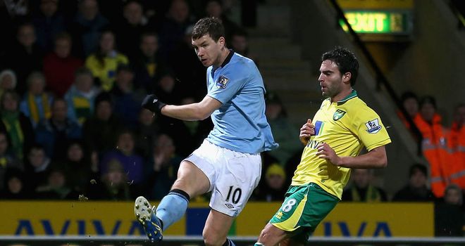 Edin Dzeko: At the double for Man City away at Norwich.