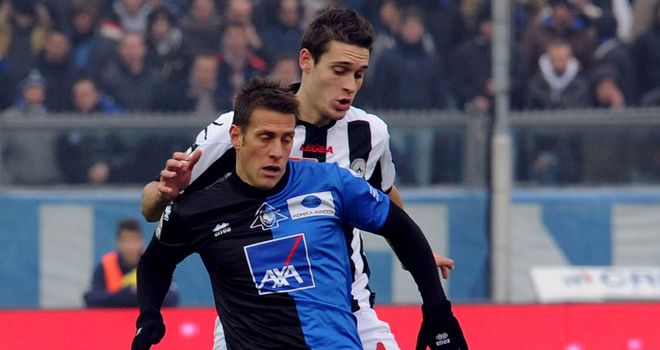 Denis and Angella battle for the ball
