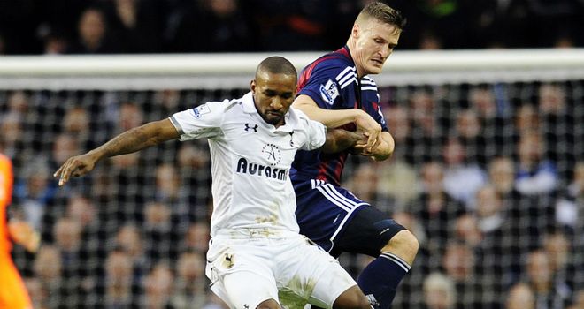 Jermain Defoe battles with Robert Huth in a tight first half