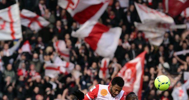 Jordan Loties and Henri Saivet challenge for a header.