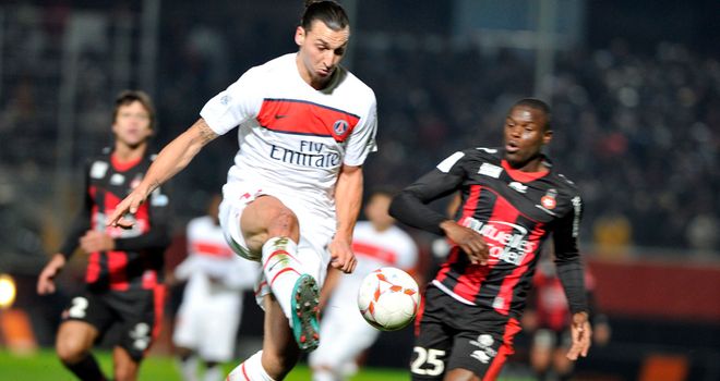 Zlatan Ibrahimovic challenges for the ball