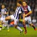 West Ham midfielder Mark Noble ensures West Brom striker Shane Long has little time in possession