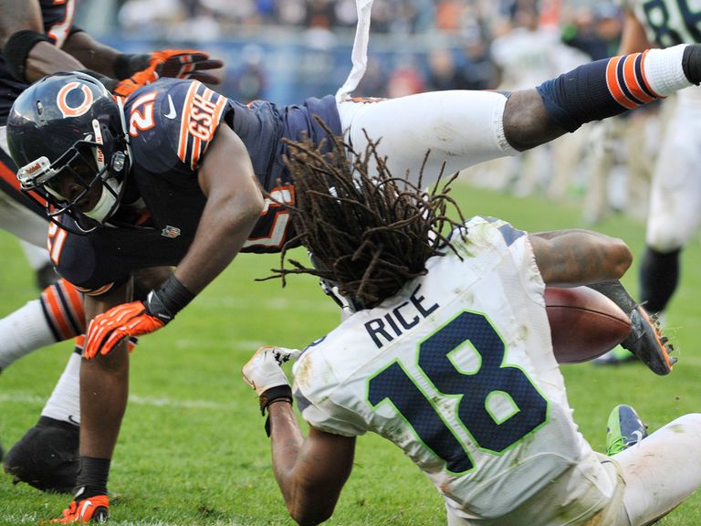 Rice takes a blow as he scores the winning TD