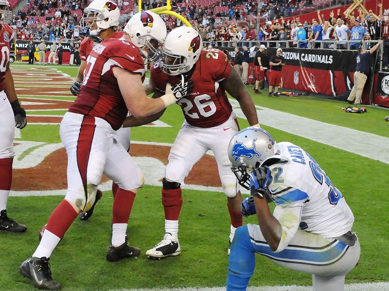 Beanie Wells scored three touchdowns as the Arizona Cardinals ended their nine-game winless run with victory against Detroit