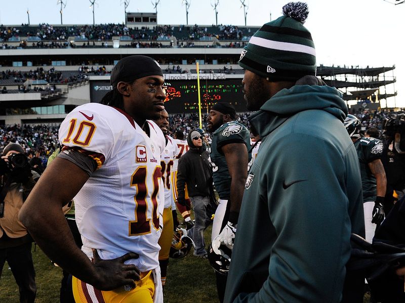 Robert Griffin III speaks to Michael Vick after the game