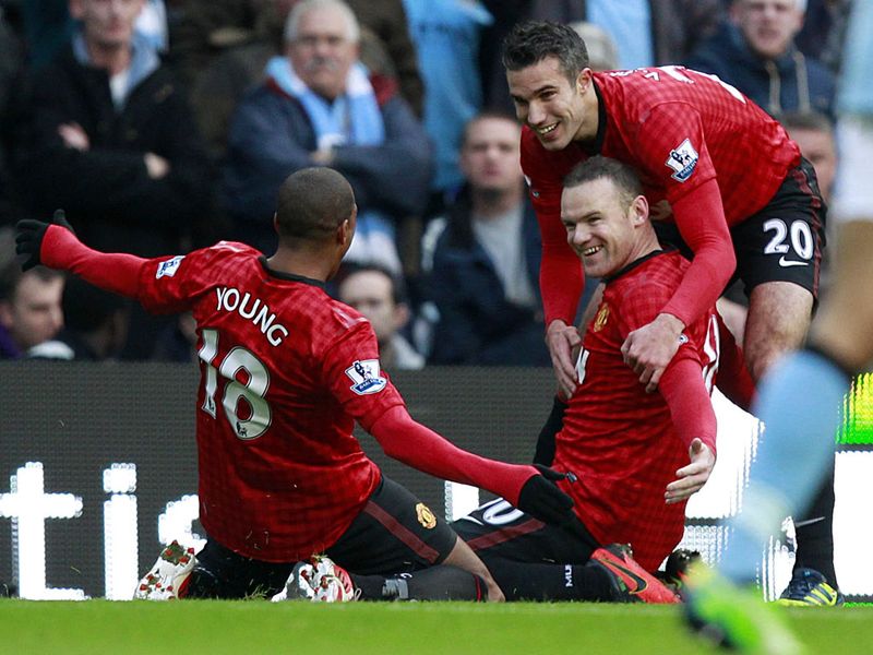 Wayne Rooney celebrates after sliding United into the lead