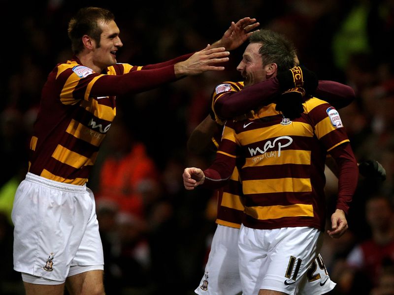 On Tuesday night, Bradford celebrate after taking a shock lead against Arsenal