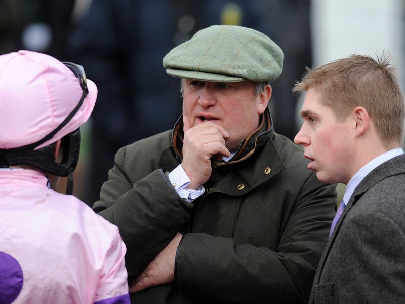 Paul Nicholls and assistant Dan Skelton (right) discuss post-race plans with Ruby Walsh