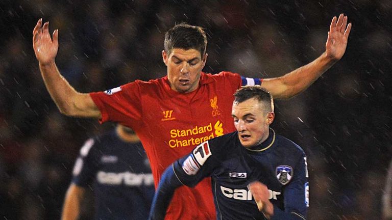 Steven Gerrard: Liverpool midfielder tussles with Oldham's Carl Winchester