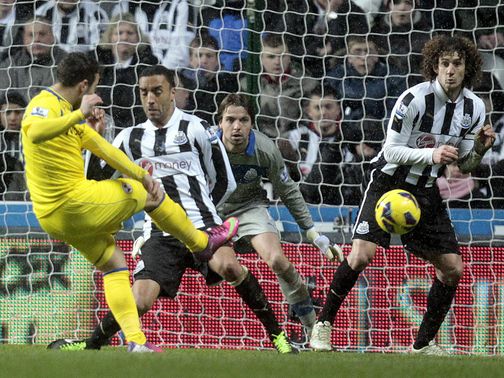 Reading's Adam Le Fondre scores one of his two goals at Newcastle