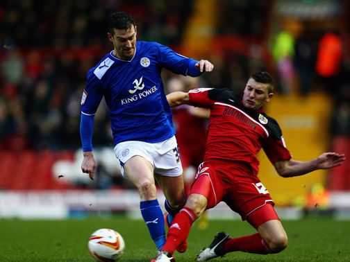 David Nugent is tackled by James Wilson