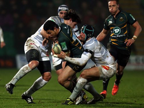 Northampton's George Pisi is tackled